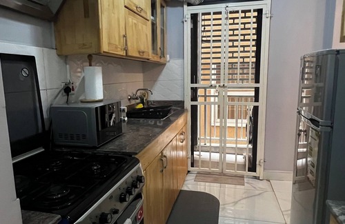 Central Kampala Apartment | Charming 1-bedroom apartment with fitness room and AC in lovely Kampala