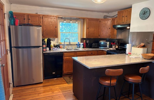 Oakland House | Charming 1840s farmhouse with donkeys, wood stove, fire pit, and full kitchen