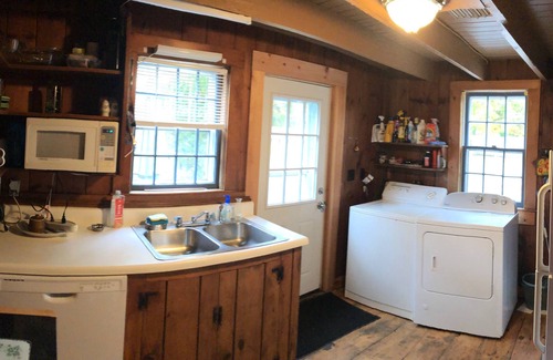 Dennis Cottage | Charming 18th century cottage with its own beachfront on Scargo Lake near bay