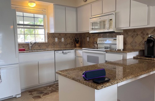 Pelican Condo | Charming 2-bedroom condo with WiFi, in Cape Coral with pool, spa, & water view.