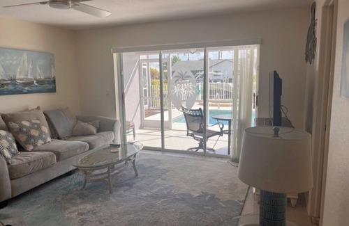Pelican Condo | Charming 2-bedroom condo with WiFi, in Cape Coral with pool, spa, & water view.