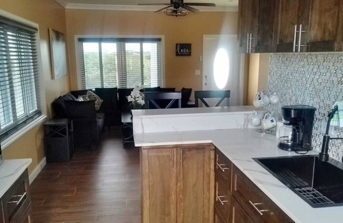Tar Bay Cottage | Charming 2-bedroom cottage with AC, WiFi, . Two-minute walk to beach.