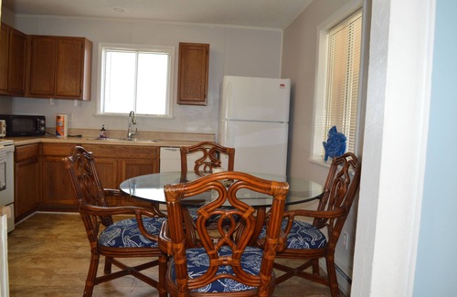 Tranquil Harbour House | Charming 2-bedroom House with screened in porch WiFi, AC in beautiful Oak Island