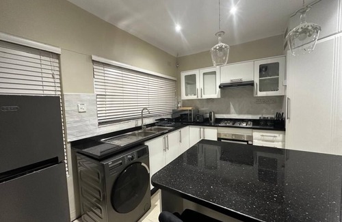 Harare House | Charming 2-bedroom house in peaceful Harare with a Pool ,AC, WiFi & fitness room