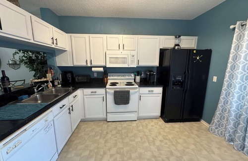 Peridia Country Club House | Charming 2-bedroom Key West style townhome with pool! Lakefront Serenity