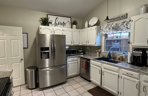 Lexington House | Charming 3-bedroom house with premier back yard space and koi pond