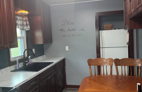 Clinton House | Charming 3-bedroom pet friendly house with fenced in yard in Clinton, IA.