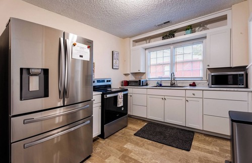 Cary House | Charming 4BR Cape Cod Near Downtown Cary and Parks