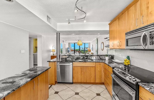 Columbiad Plaza Condo | Charming 5th floor 2-bedroom condo with views of canal, river and Port Canaveral