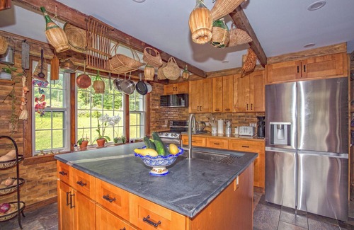 Williamstown House | Charming barn ski house with exposed rustic beams and cathedral ceilings.