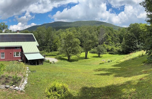 Williamstown House | Charming barn ski house with exposed rustic beams and cathedral ceilings.