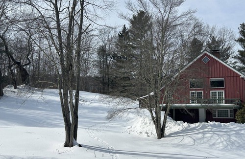 Williamstown House | Charming barn ski house with exposed rustic beams and cathedral ceilings.