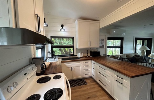 Lake Leelanau House | Charming beach house on Lake Leelanau. Includes kayaks and a fireplace.
