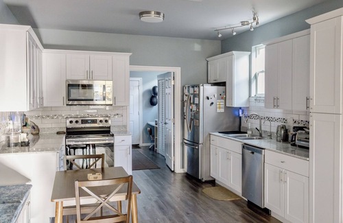 Florida Area House | Charming Blue Retreat with home gym, EV hookups, king bed, and more
