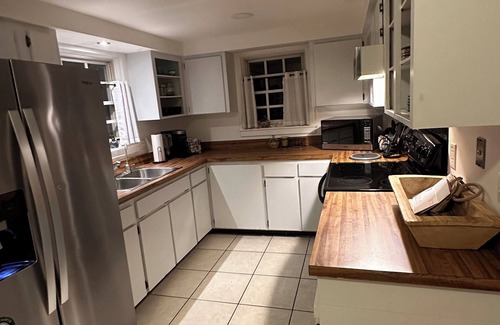 Colonialtown North House | Charming bungalow with plunge pool located steps away from trendy Mills 50 area.