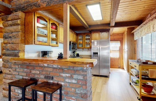 Woodlands Cabin | Charming cabin with wood-burning fireplace, private yard, porch, & W/D
