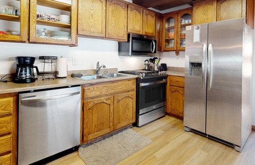 Woodlands Cabin | Charming cabin with wood-burning fireplace, private yard, porch, & W/D