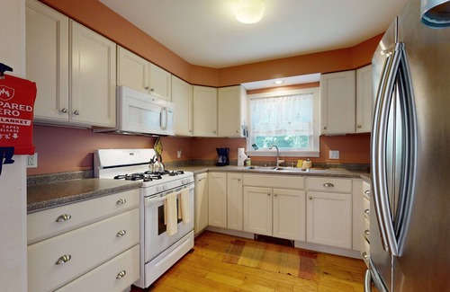 Bath House | Charming Cape-style House with Panoramic River Views and Modern Amenities