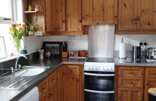 Garryvoe Cottage | Charming Coast guard cottage overlooking Ballycotton harbour. Garden and yard.