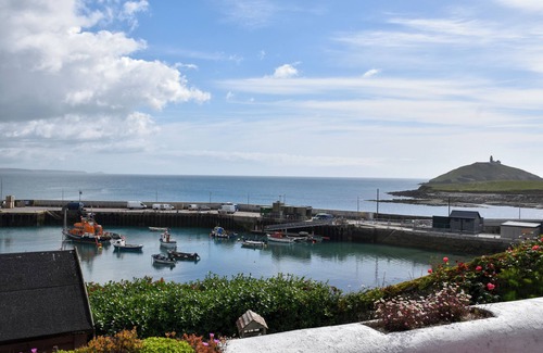 Garryvoe Cottage | Charming Coast guard cottage overlooking Ballycotton harbour. Garden and yard.