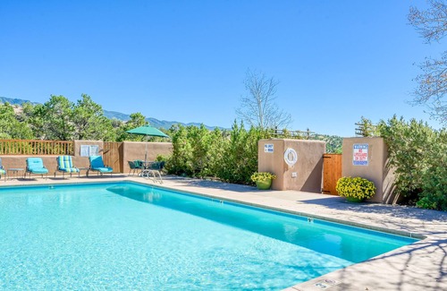 Nambe Pueblo Apartment | Charming condo with fireplace, patio, grill, W/D, & pool - quiet location