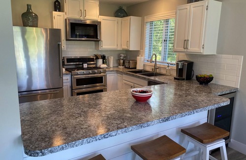 Elk Rapids House | Charming Cottage on Elk River in Elk Rapids – Your Summer Getaway Awaits!
