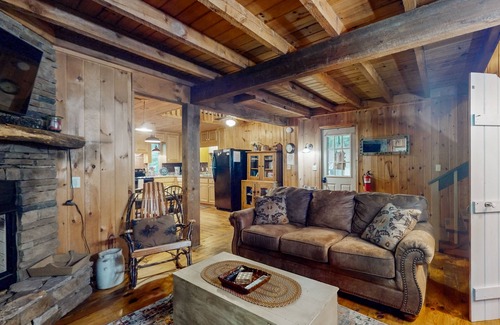 Raccoon Ridge Cabin | Charming, dog-friendly cabin with a private hot tub, outdoor fireplace, & yard