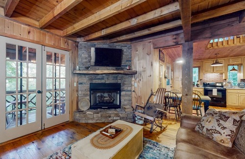 Raccoon Ridge Cabin | Charming, dog-friendly cabin with a private hot tub, outdoor fireplace, & yard