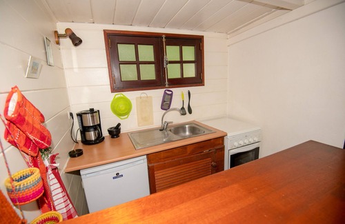 Maniron House | Charming exotic wood bungalow with pool in a tropical garden.