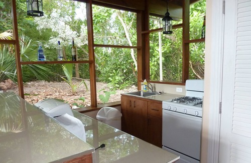 Leeward Settlement Cottage | Charming Garden Cottage on the canal in Leeward