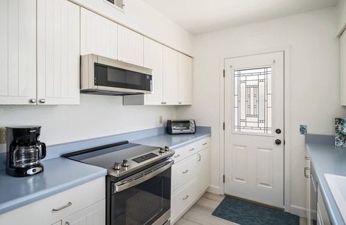 Park Hill House | Charming Home on the Hill with Ocean Views - two Queen beds and one full bed