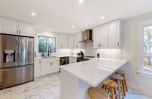 Lagoon Heights House | Charming home with private hot tub, firepit, deck, grill, outdoor shower, AC