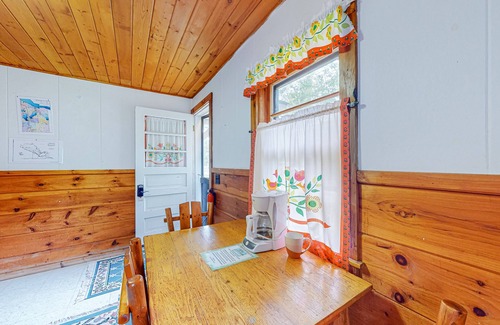 Indian River Cottage | Charming lakefront cottage with large yard, dock, & fire pit - close to downtown
