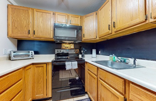 Weirs Beach Condo | Charming lakeside condo with fireplace, pool, tennis, balcony, & fast WiFi