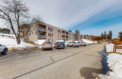 Weirs Beach Condo | Charming lakeside condo with fireplace, pool, tennis, balcony, & fast WiFi