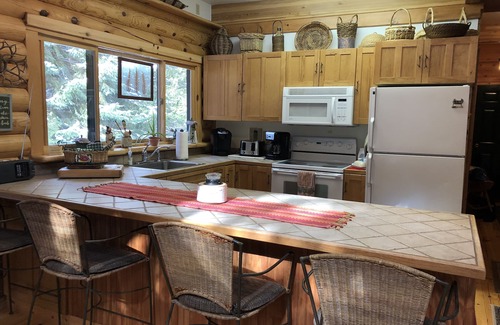 Boyne Falls Cabin | Charming Log House with WIFI Steps Away from Boyne River and enhanched cleaning.