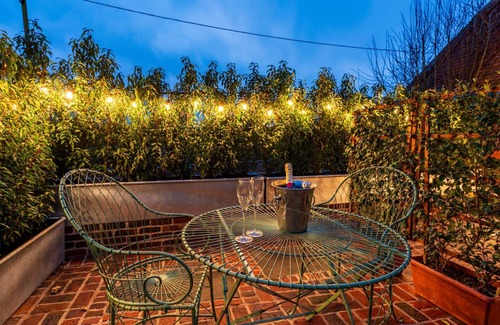 Ipswich Cottage | Charming medieval cottage courtyard garden and wood burner in serene Kersey