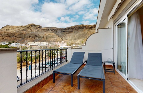 Playa de Mogan Condo | Charming, modern apartment with terrace, directly on the sea, free WiFi