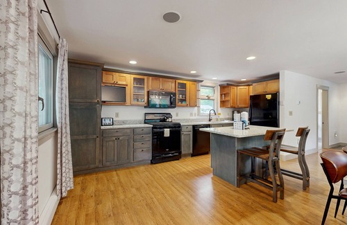 Sunday River Area Ski Chalet | Charming mountain chalet with a hot tub, fire pit, and room for the whole family