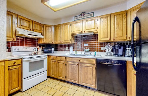 Jackson Condo | Charming mountainside condo with fireplace, skiing, patio, & washer/dryer