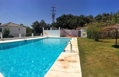 Higuera de la Sierra Villa | charming rustic house in development with pool. Perfect for family