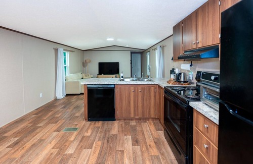 Clewiston House | Charming retreat with fire pit, games, and space for up to 5 guests. Book today.