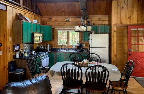 Wiscasset House | Charming riverfront home with cozy interiors, dock, and scenic deck views