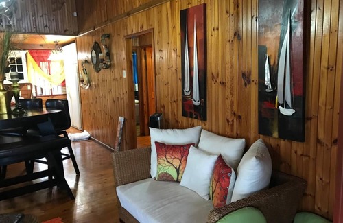 Signal Hill Cabin | Charming SEAVIEW lodge TUCKED IN THE MOUNTAINSIDE of Signal Hill TOBAGO