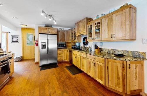 Tahoe Paradise House | Charming two-story cabin with a private hot tub, patio, & large backyard