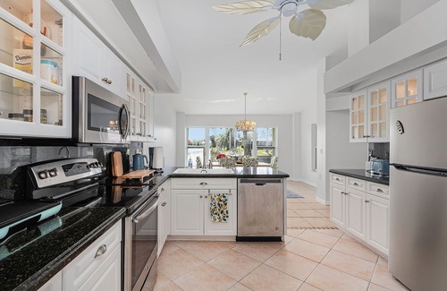 Cape Coral House | Charming Villa Chandelier located at an intersecting canal