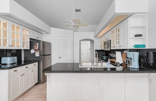 Cape Coral House | Charming Villa Chandelier located at an intersecting canal