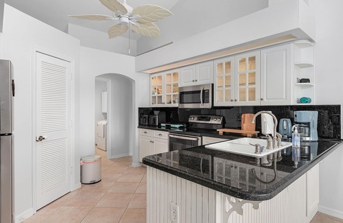 Cape Coral House | Charming Villa Chandelier located at an intersecting canal