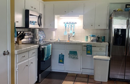 Natchitoches House | Charming water front cottage on Cane River with stunning sunroom & private decks