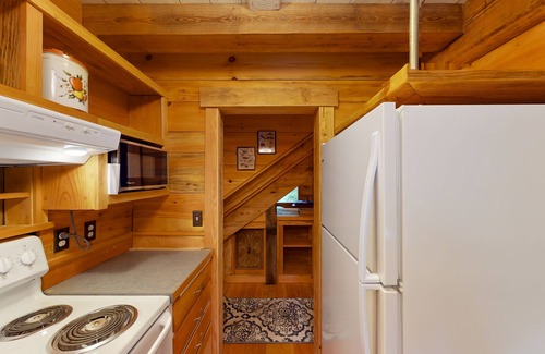 Clinton House | Charming woodland cottage with 2 covered porches, wood stove, treehouse, firepit